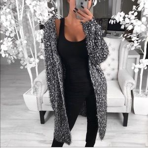 @itselaine fuzzy black and white cardigan